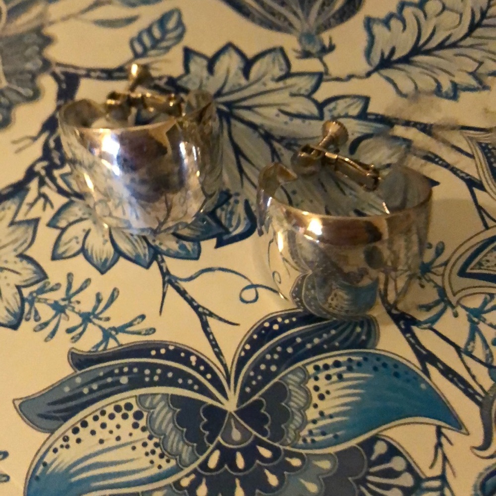 Sterling silver very wide hoop earrings.